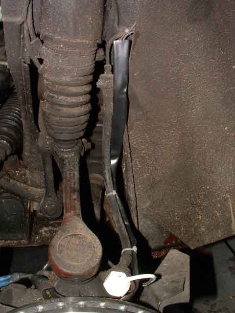 THIS PATH FAILS.  Attempted to secure the wire to the brake line, but it failed so we no longer secure the wires as shown here.