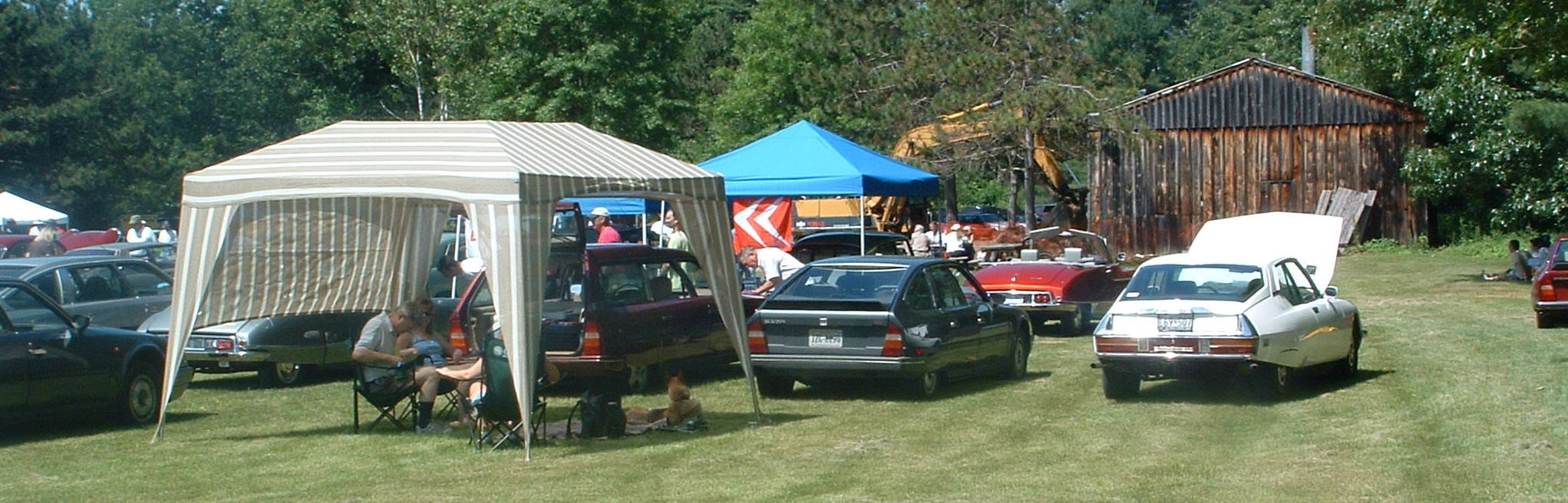 Three of our Citroëns
		at Rendezvous 2007, held in Saratoga Springs, New York.  From left, the maroon CX is the 1987 Safari, next is the 
		1987 CX 25 GTI, and that's Dad's white 1973 SM.